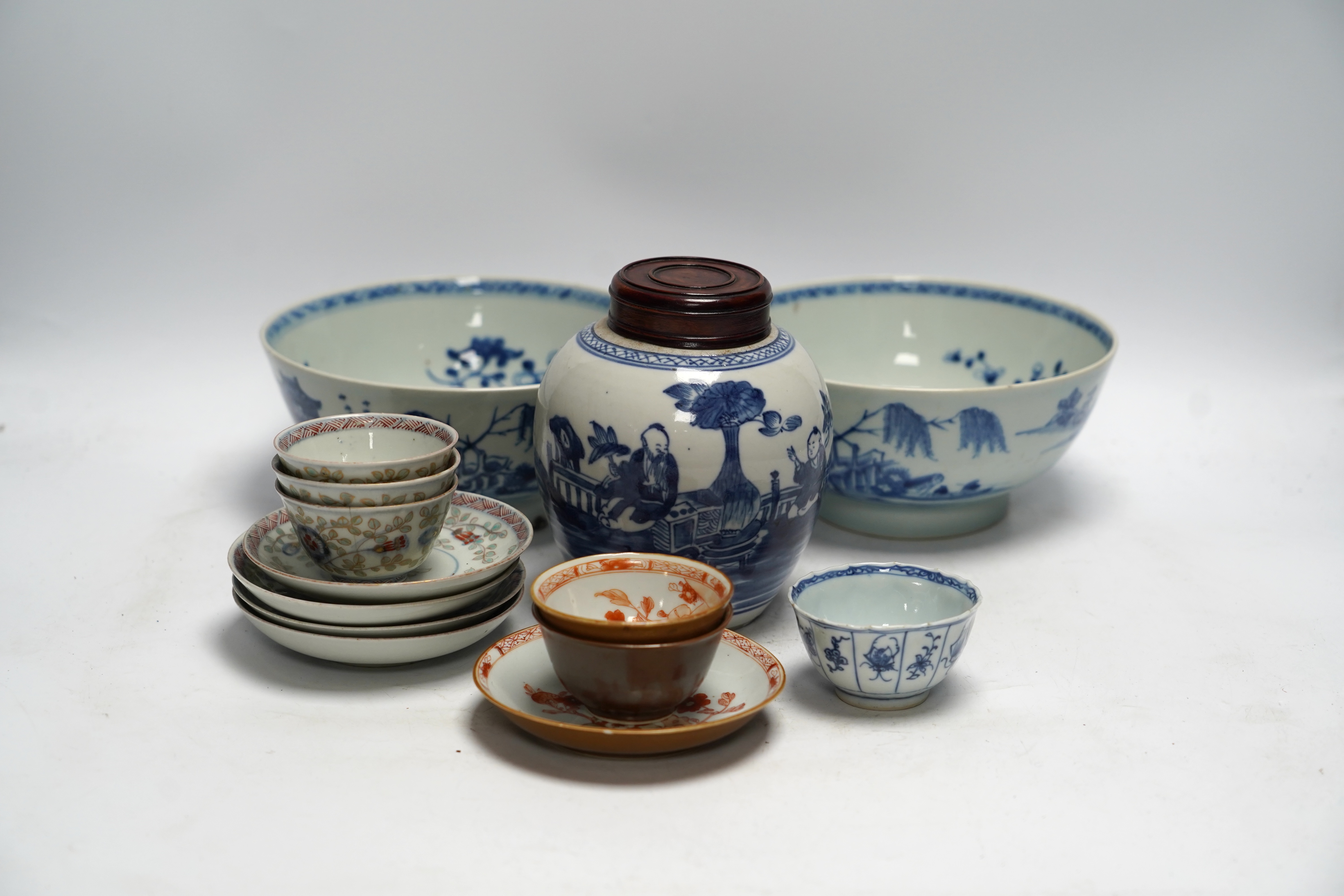 A group of 18th century Chinese and Japanese porcelain including blue and white bowls and jar with hardwood cover, largest 19cm in diameter